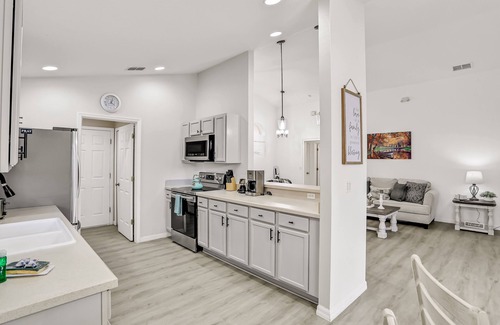 Lake Wilson Preserve House | Pleasant pool-view home with private pool, patio, streaming, enclosed lanai & AC