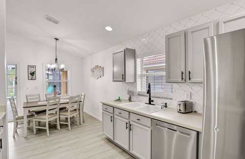 Lake Wilson Preserve House | Pleasant pool-view home with private pool, patio, streaming, enclosed lanai & AC