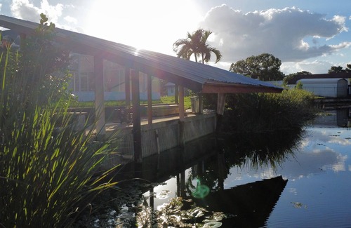 Taylor Creek House | Pool house with lake access