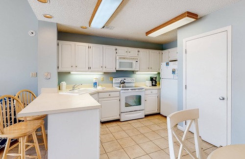 East End House | Poolside dog-friendly townhouse with partial Gulf views, on-site pool & grills