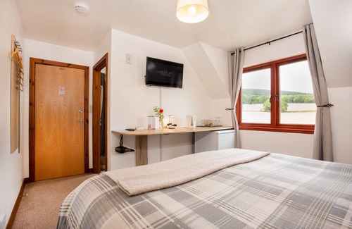 Alness Bed & Breakfast | Private En-Suite Room with calming views over barley fields and forests beyond.