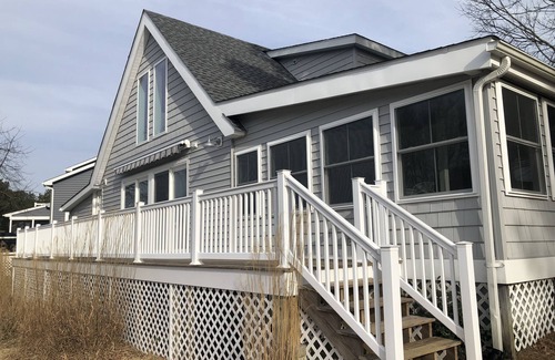 Ocean Pines Cottage | Pura Vida.Canal front beach cottage with private dock and sleeps 8
