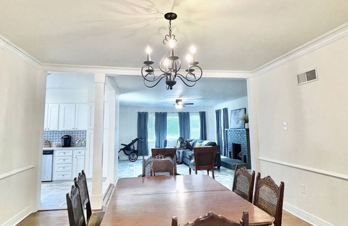 Midtown Cottage | Quaint cottage style home with two sitting areas-2 minutes to shops and eateries