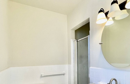 Midtown Cottage | Quaint cottage style home with two sitting areas-2 minutes to shops and eateries