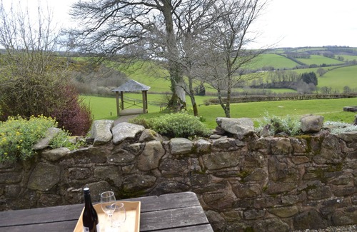 Wheddon Cross Cottage | Quarme Cottage is located in the heart of Exmoor National Park at Wheddon Cross. Dog friendly