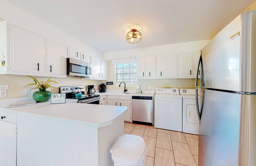 Dauphin Island Condo | Quiet home with WiFi, pool, view of water, & boardwalk to beach