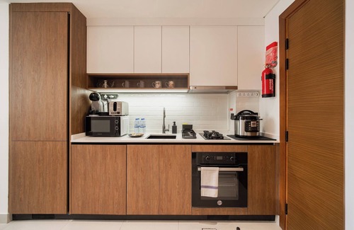 Dubai Apartment | Quiet Top-Floor Studio Near Metro + Baby Gear