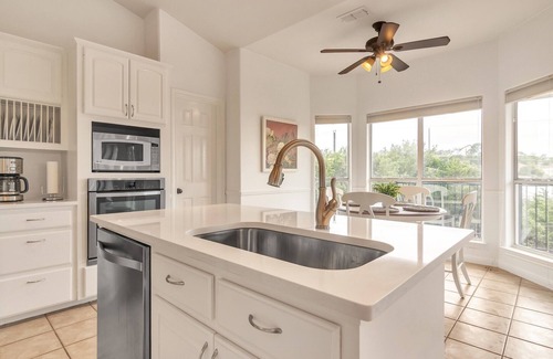 Travis Landing House | Relax at the pool after touring Austin! Marinas close by to enjoy Lake Travis!