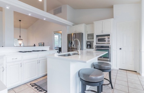 Travis Landing House | Relax at the pool after touring Austin! Marinas close by to enjoy Lake Travis!