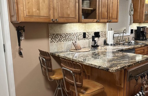 Pocatello Apartment | Relax in a serene patio oasis & a rejuvenating massage chair after a long day!