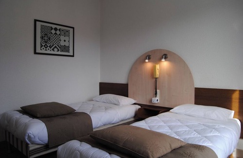 Lourdes Hotel | Relax in Comfort, Pet-Friendly, Free Parking, Onsite Restaurant, Scenic Views!