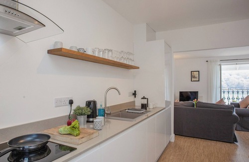 Fowey Cottage | Relax on the balcony and watch the boats sail by.