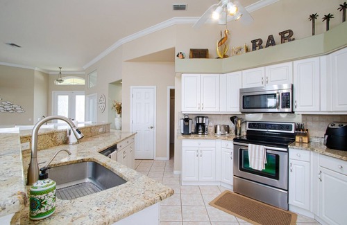 Pelican House | Relax & Unwind: Family Friendly Home with Private Heated Pool and Canal Views!
