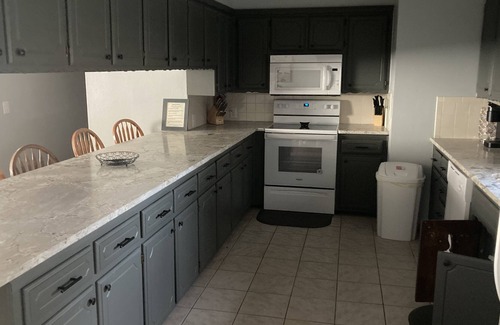 Longtown House | Relaxing Lake Retreat w/firepit, sunroom, patio. Walking distance to water.