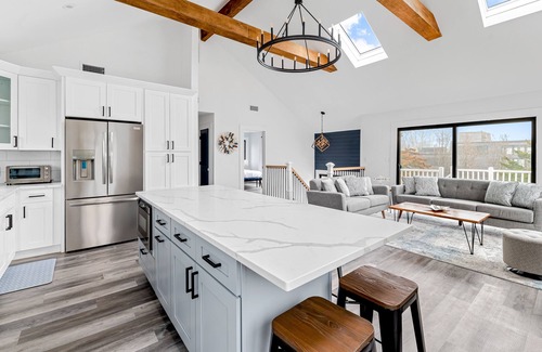 Hampton Bays House | Renovated retreat with a pool, grill, firepit, in-home gym, W/D, & AC