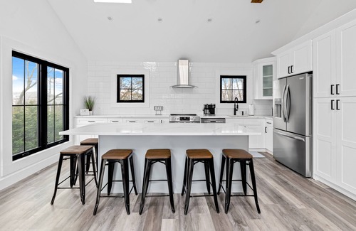 Hampton Bays House | Renovated retreat with a pool, grill, firepit, in-home gym, W/D, & AC