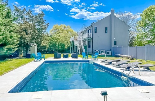 Hampton Bays House | Renovated retreat with a pool, grill, firepit, in-home gym, W/D, & AC