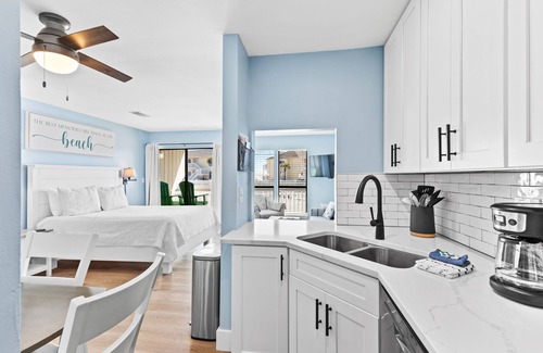 Emerald Coast Apartment | Renovated Studio condo with partial view of beach dunes-Beach Service included