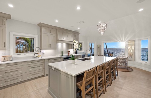 Captiva House | RENT NOW! NEW, WATERFRONT HOME, IN VILLAGE, POOL, HOT TUB, DOCK, PUTTING GREEN!
