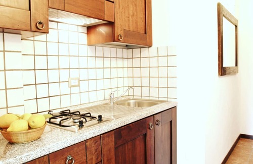 Teulada Apartment | Residenza Locci Aparthotel & Rooms Studio Apartment with Terrace in the greenery in the center of Teulada.