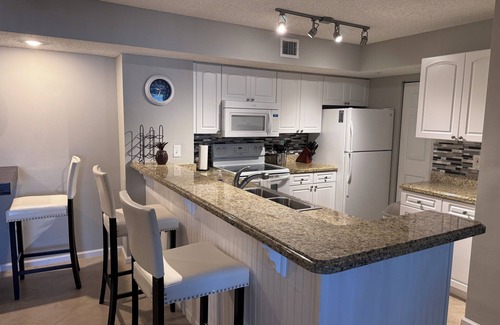Tequesta Condo | Resort style condo, Ground level w garage, 5 min to beach, heated pool