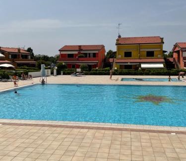 Caorle Apartment | RESORT VILLAGE AQUA MARINA FAMILY - Daily Rooms Tidying - CocktailsBar- Pet Friendly - with Hypermarket - Delivery Restaurant-Pizzeria - Room Breakfast with supplement - Ultra Fast Wi-Fi - Play Area for children - Olympic Swimming Pool - Parking