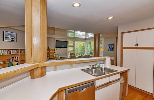 Bald Head Island House | Resting in treetop, two golf carts close to island amenities