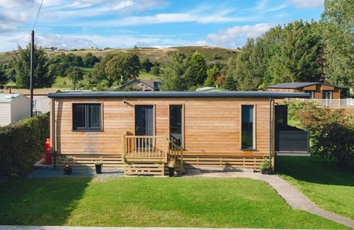 Llanfair Caereinion Cottage | River View 13 is a four berth large glamping cabin.