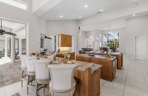 Pelican House | Riverfront Luxury with Heated Pool, Spa & Private Dock – Sunny Shores Escape