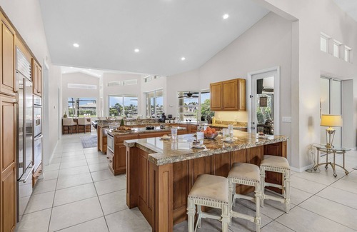Pelican House | Riverfront Luxury with Heated Pool, Spa & Private Dock – Sunny Shores Escape