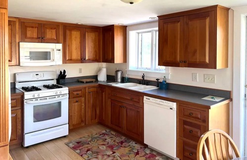 Brandon Cottage | Romantic lake view retreat with a patio, full kitchen, & washer/dryer