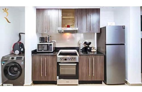 Abu Dhabi Apartment | Roxen Retreat 1BR - Comfortable Poolside Living Near Al Reef Beach