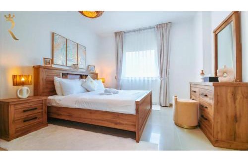 Abu Dhabi Apartment | Roxen Retreat 1BR - Comfortable Poolside Living Near Al Reef Beach
