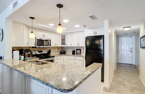 Indian Shores Condo | Sand Castle III # 203 DIRECT GULF FRONT Condo Private Staircase to Pool & MORE