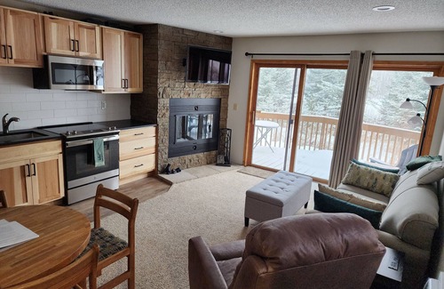 Mancelona Condo | Schuss Village, Fall colors, sleeps 6 condo w/2 bathrooms, wood fireplace
