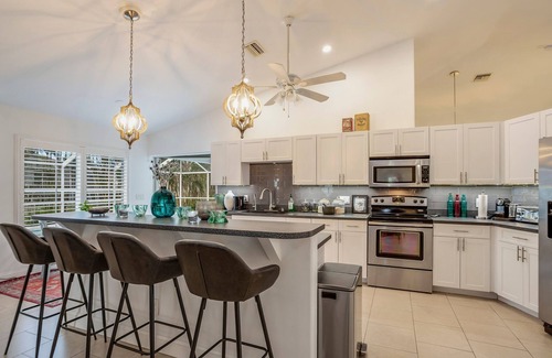 Burnt Store House | SEASIDE COTTAGE - Southern fenced yard, tropical fruit trees, pool, contemporary