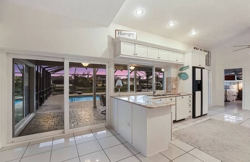 Apollo Beach House | Seaside Oasis! Dog-Friendly, Waterfront, Private Dock, Saltwater Pool & Spa,
