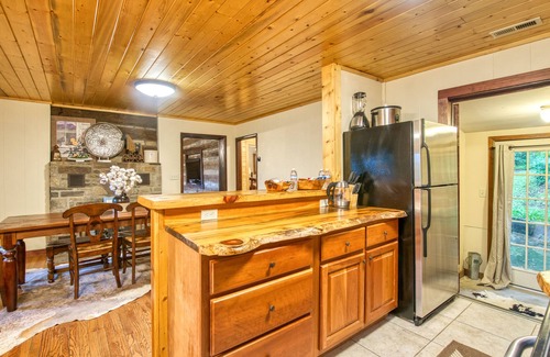 Bryson City Cottage | Secluded cottage in quiet, walkable location with WiFi, fire pit, grill & deck