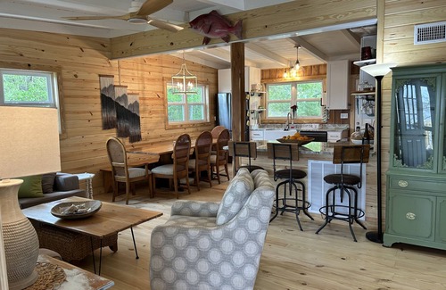 Fairhope Cabin | Secluded waterfront fishing cabin, boat dock, pier, sunsets, boat to beach