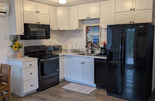Coeur d'Alene House | SEE YOU IN THE SPRING! Close to Coeur D' Alene yet set in a wooded atmosphere.