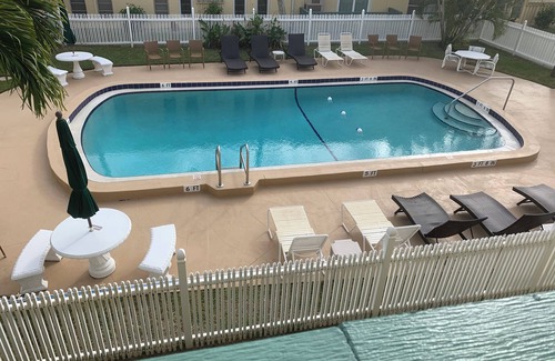 Port Canaveral Condo | Serene 2bedroom condo overlooking heated pool 1 block from Cape Canaveral beach.