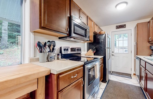 Gilford House | Serene getaway with private sauna, firepit, deck, grill, balcony, & washer/dryer