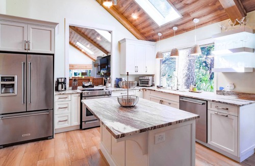 West Beach House | Short Stroll to Beach! Exquisitely Renovated Home w/Pool & Hot Tub, Spacious Deck & Lagoon Views!