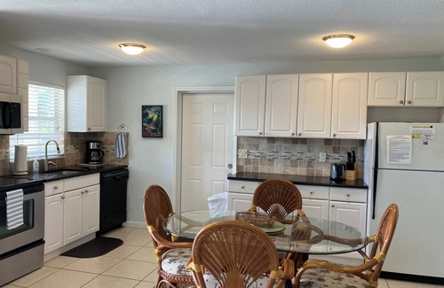 Siesta Key Village House | SHORT WALK TO VILLAGE, BEACH - HEATED POOL - LUSH LANDSCAPINGn2 SEPARATE UNITS.