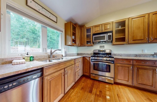Gilford House | Single-story home overlooking Lake Winnipesaukee with firepit, fireplace & WiFi