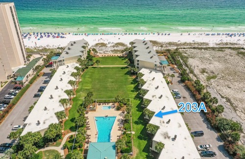 Destin Condo | Sip a glass of wine on our balcony Private Beachfront views pool large courtyard