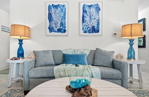 Destin Condo | Sip a glass of wine on our balcony Private Beachfront views pool large courtyard