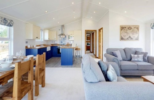 Carnforth House | Situated at Borwick Lakes, this holiday home boasts a spacious feel.