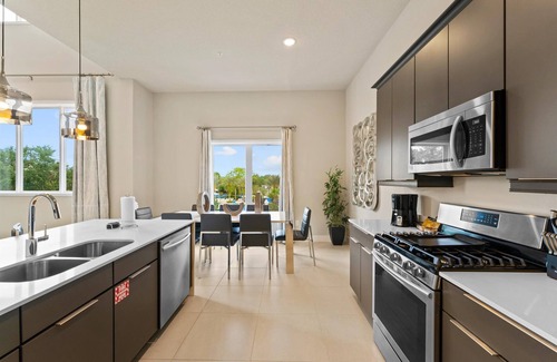 Historic Downtown Kissimmee Condo | Sleek Condo with Pool Table near Disney with Resort & Waterpark Access - B26-208