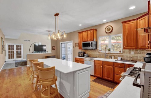 East Stroudsburg Apartment | Sleeps 12 | Sauna+Bar+Basement Game Room+Fire Pits